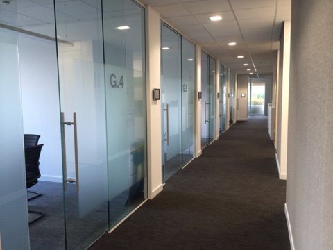 Office cubicals partitioned with glass walls